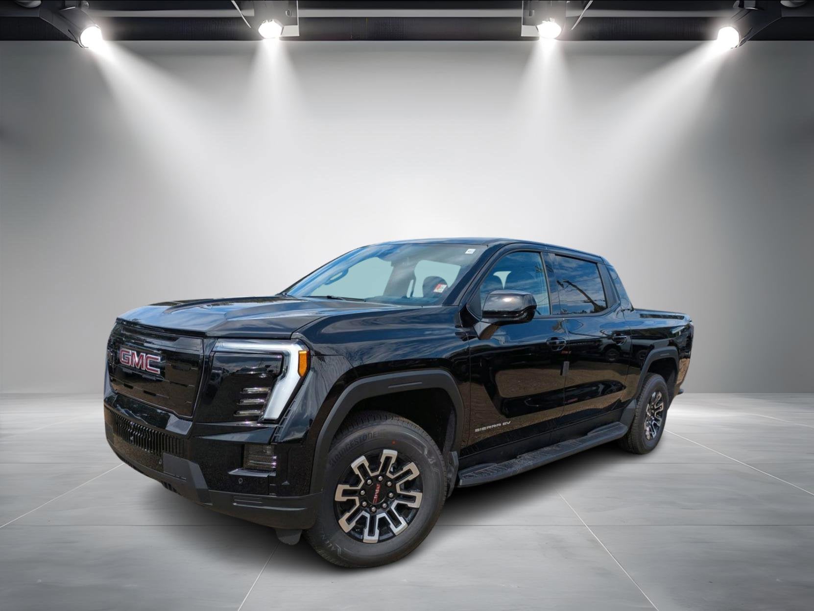 2026 GMC Sierra EV Elevation Standard Range in Onyx Black — front three-quarter view