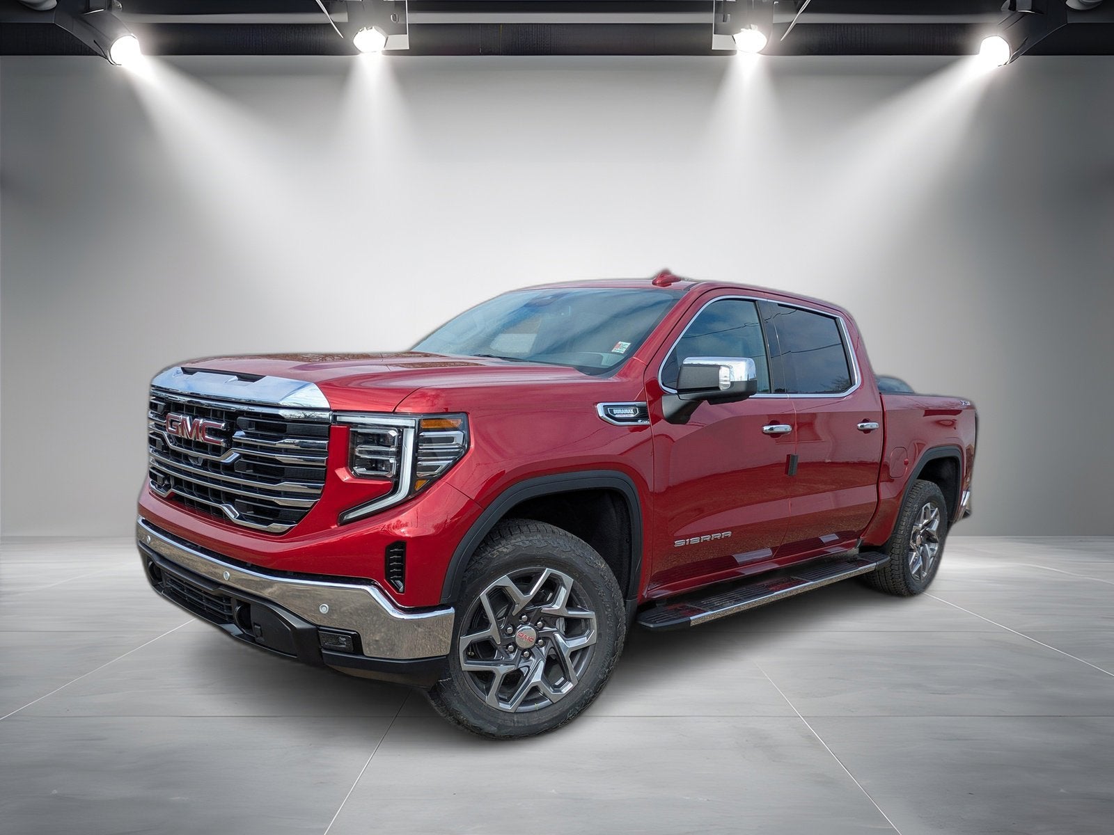 2026 GMC Sierra 1500 SLT in Volcanic Red Tintcoat — front three-quarter view